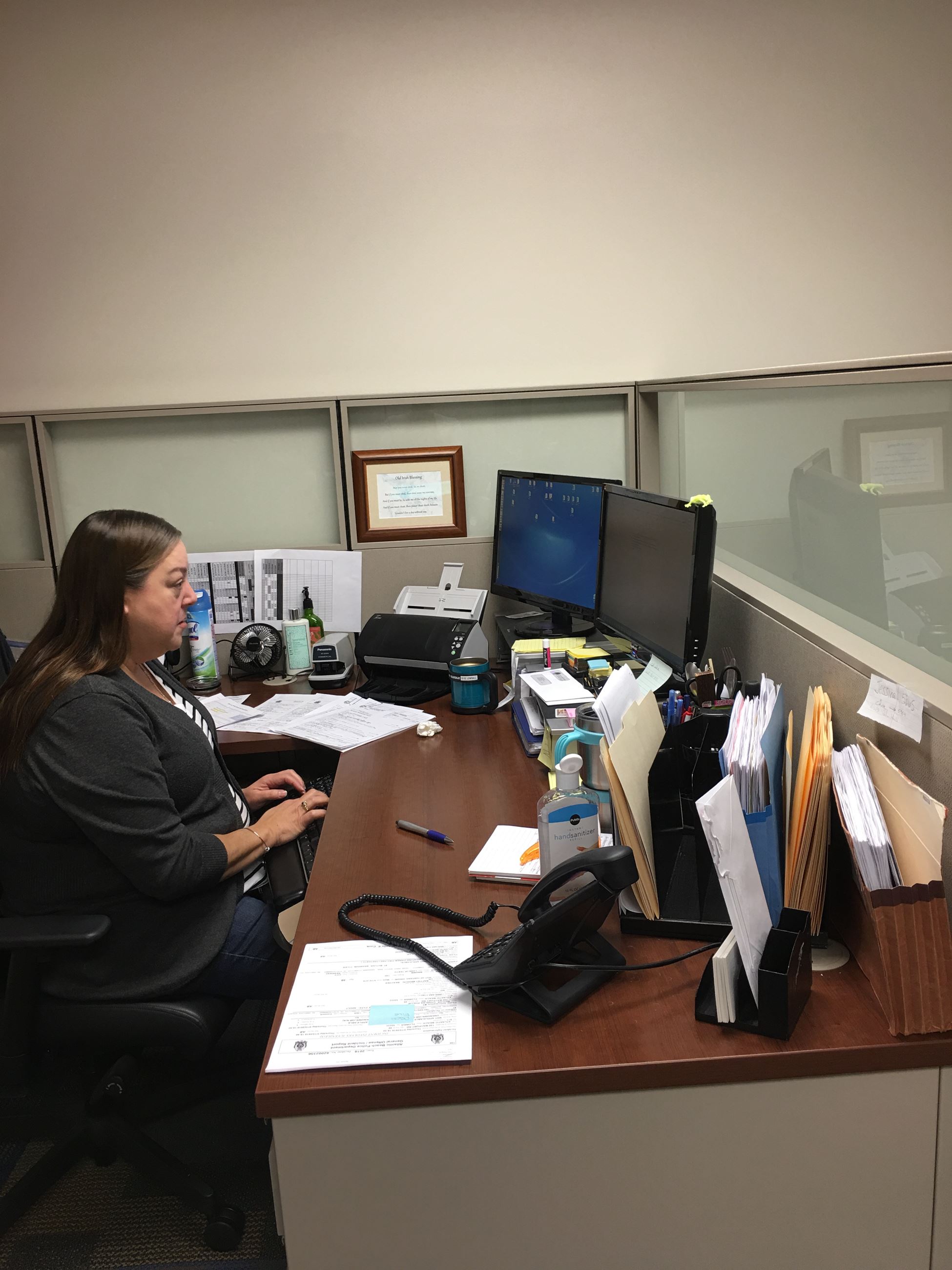Records Custodian at desk